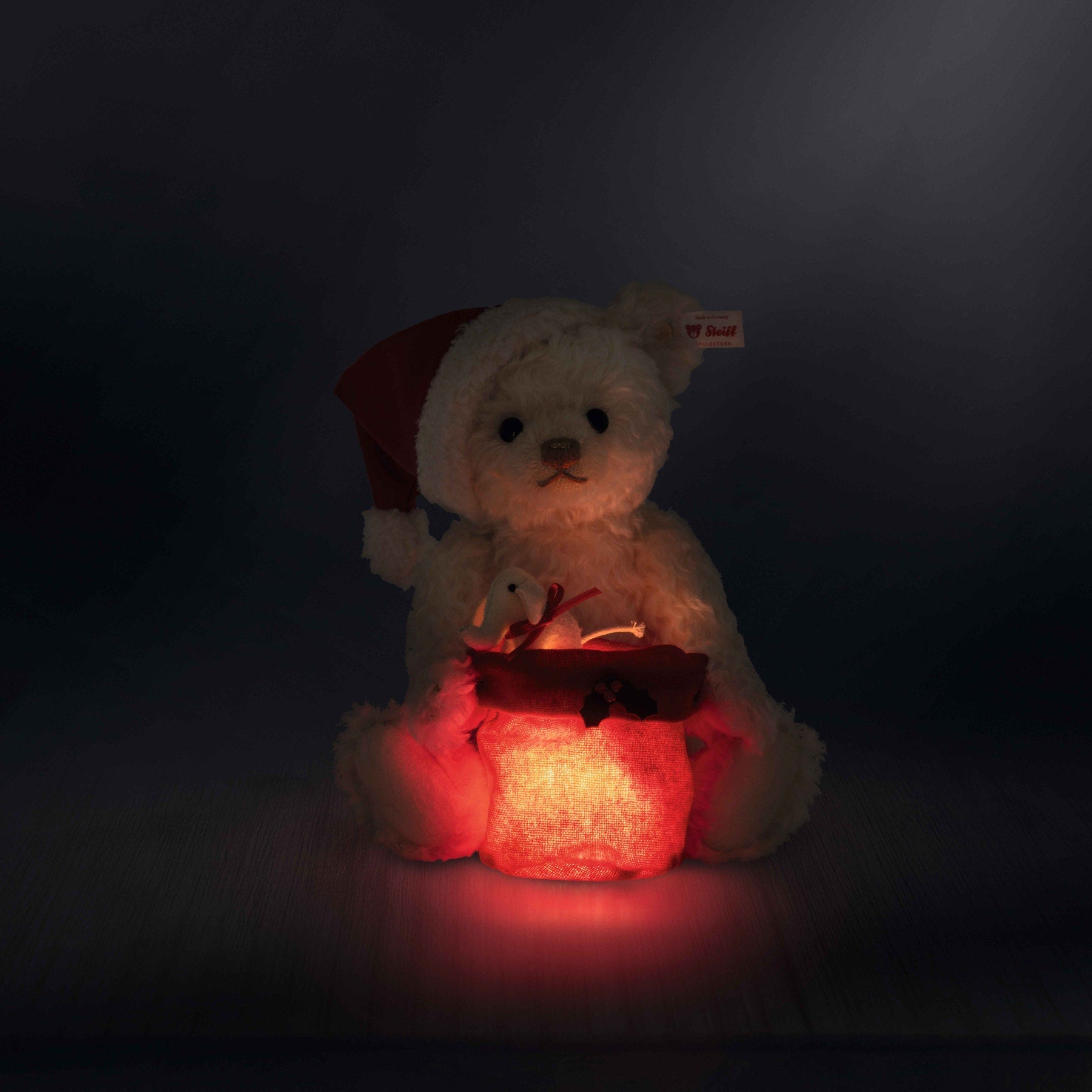 Steiff North America, Inc. - Santa Teddy Bear with Light-Up Gift Bag - Plush