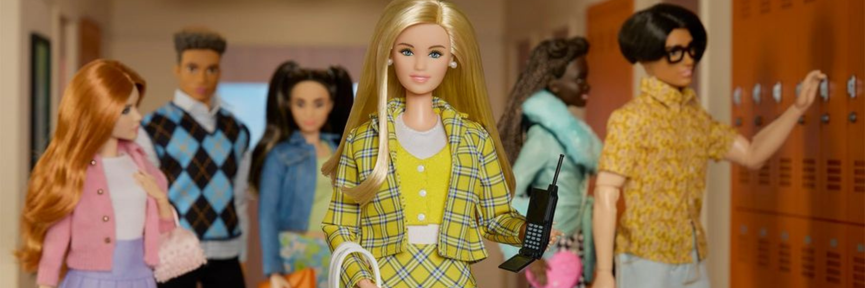 Barbie dolls in a school setting with lockers in the background