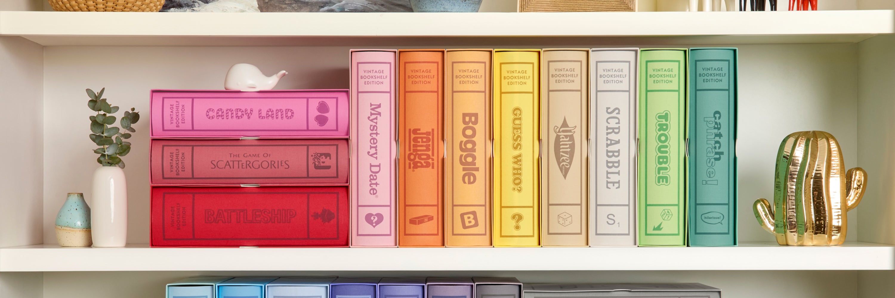 Colorful books on a shelf with decorative items