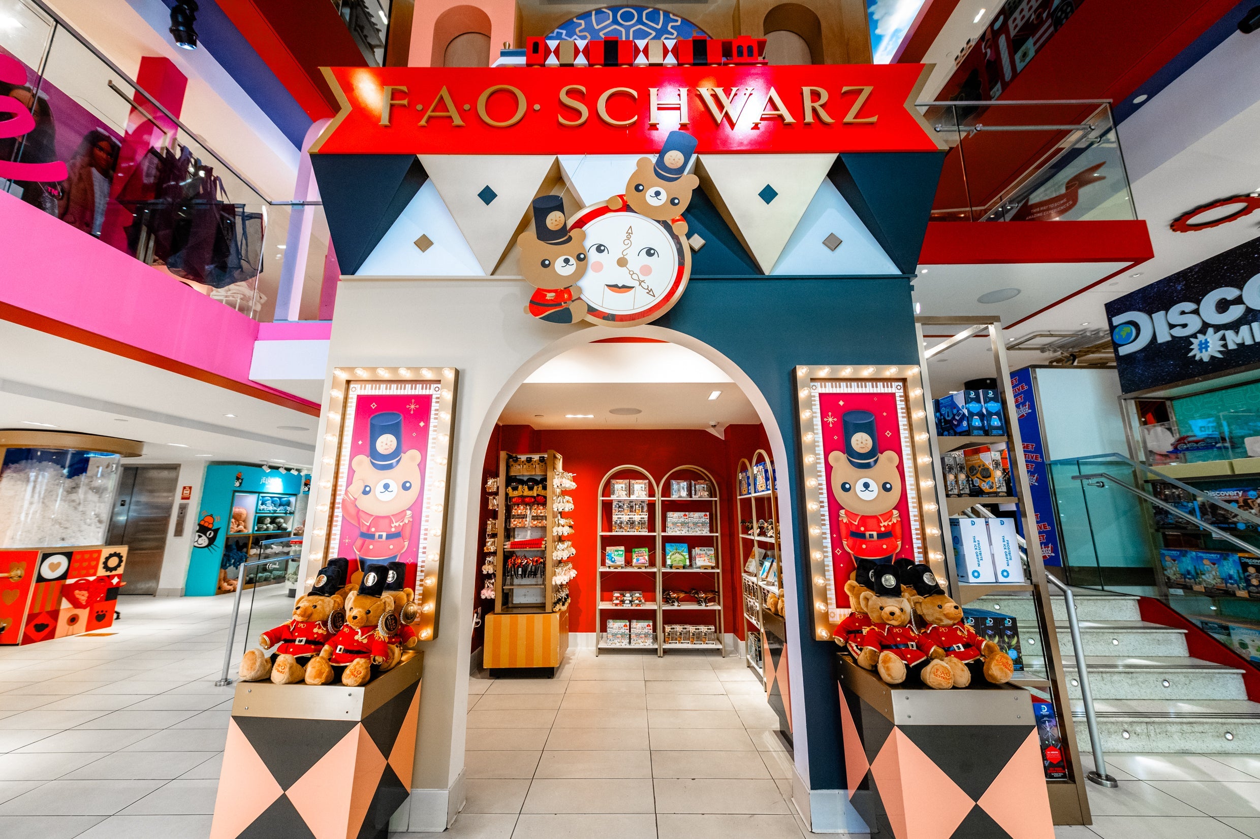 FAO Schwarz store entrance in a mall with colorful decor and toys.