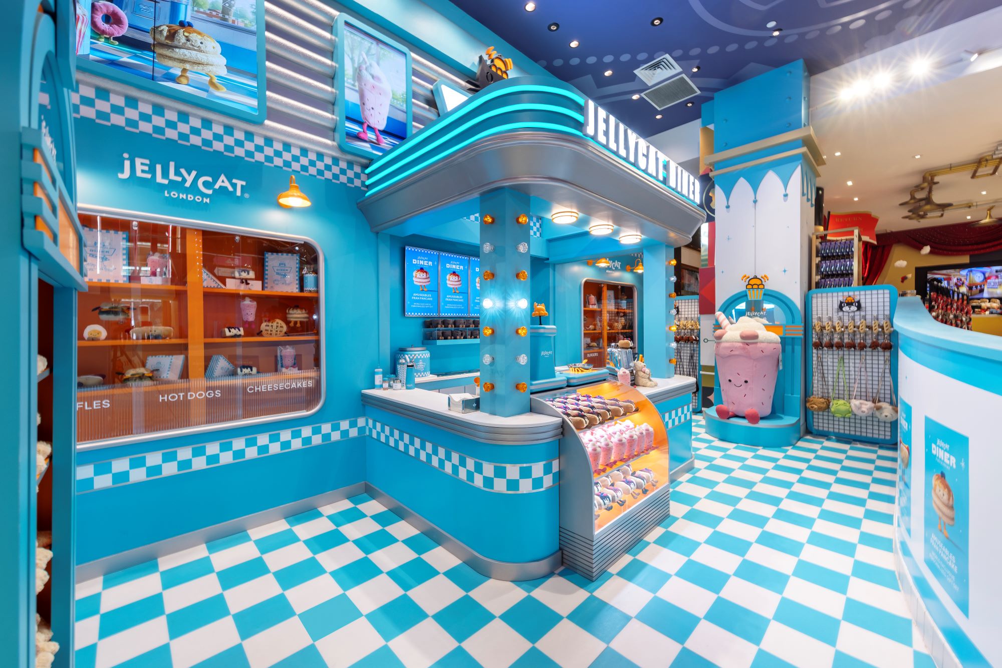 Colorful store interior with Jellycat branding and checkered floor.
