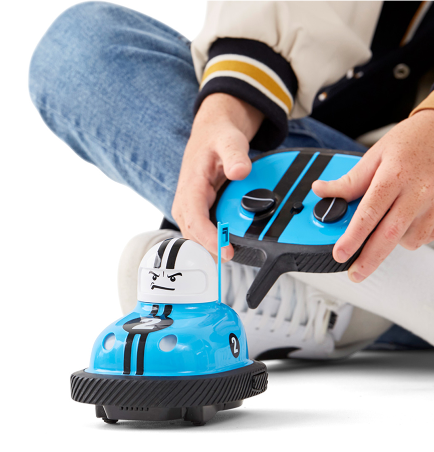 Person using a blue and black shoe polish tool on a white shoe